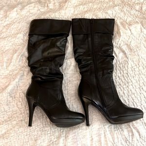 Size 7 bellow the knee black heeled boots, 3 inch heels, worn once.